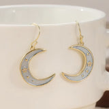Boucles d'oreilles lune et étoile pendantes (doré)