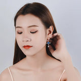Boucles d'Oreilles Pendantes Planète couleur argent