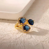 Bague ouverte acier doré, zircon bleu