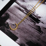 collier demi-lune inversé dorée