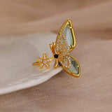 Bague ouverte acier doré, zircon bleu
