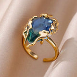 Bague ouverte acier doré, zircon bleu
