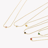 Collier pendentif zircon noir, acier doré