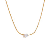 Collier pendentif zircon noir, acier doré