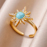 Bague ouverte acier doré, zircon bleu